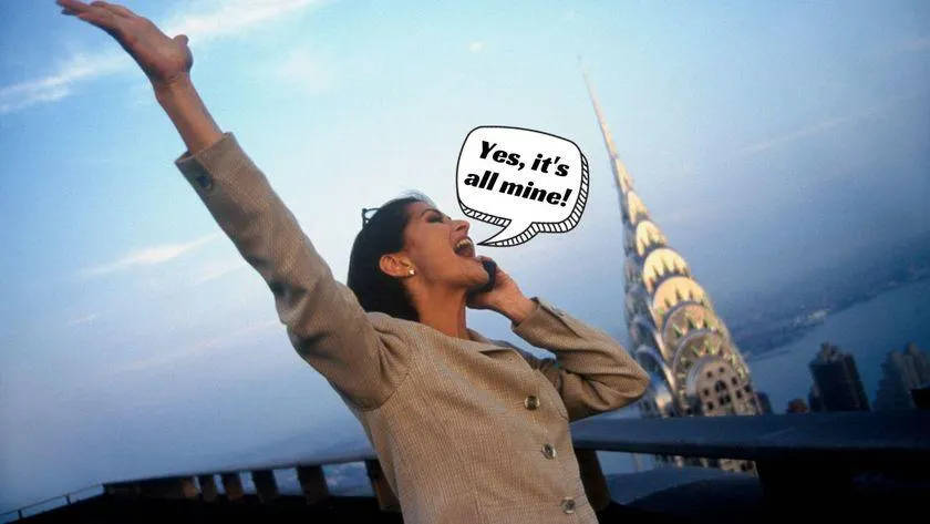 Woman talking on a cell phone, throwing her hand up in the air as she stands on a balcony with the Chrysler Building in the background: "Yes, it's all mine!"